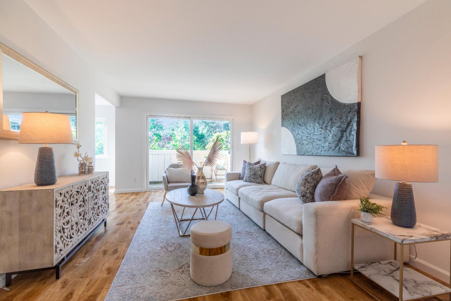 a living room with furniture and a lamp