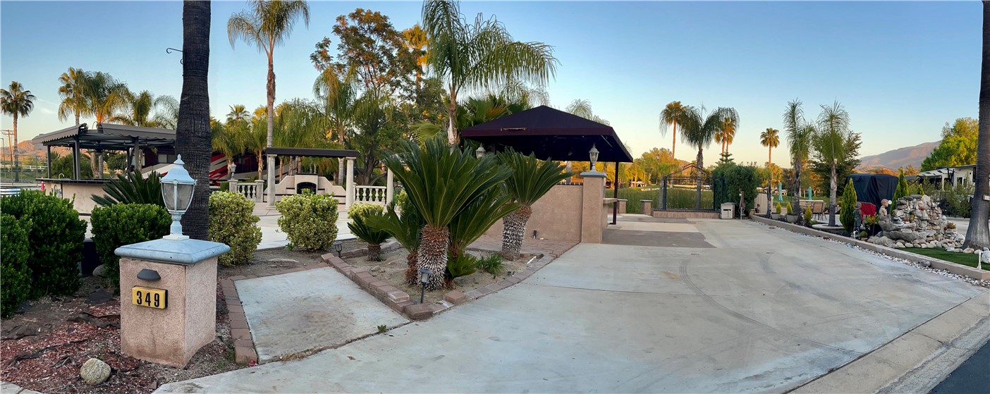 a view of a street with palm trees