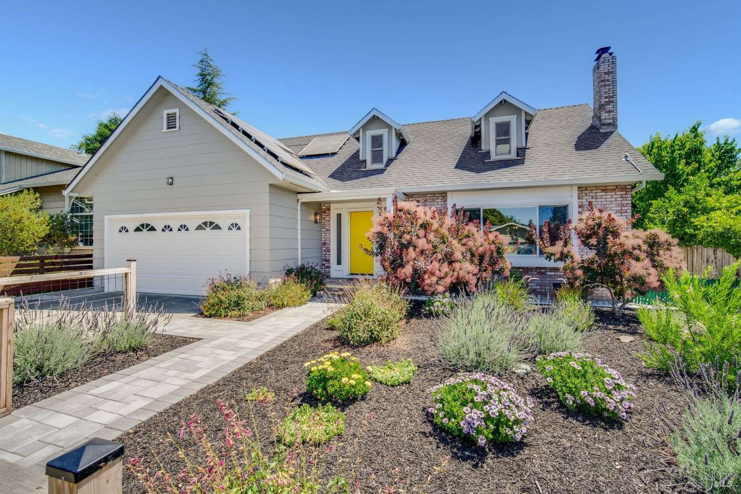 a front view of a house with a yard