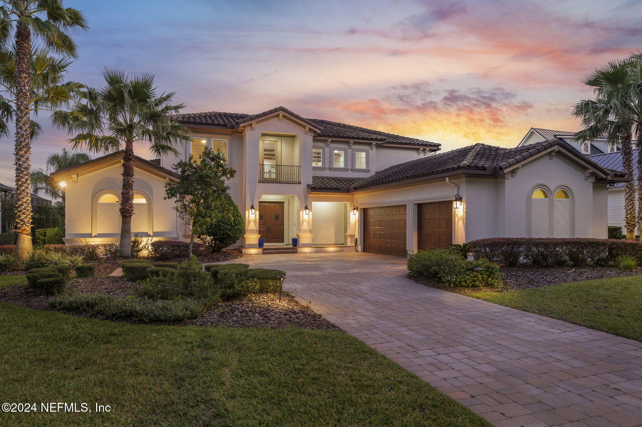 a front view of house with yard and green space