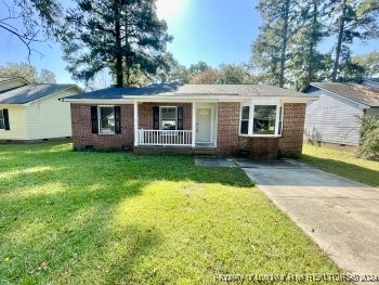 front view of a house with yard