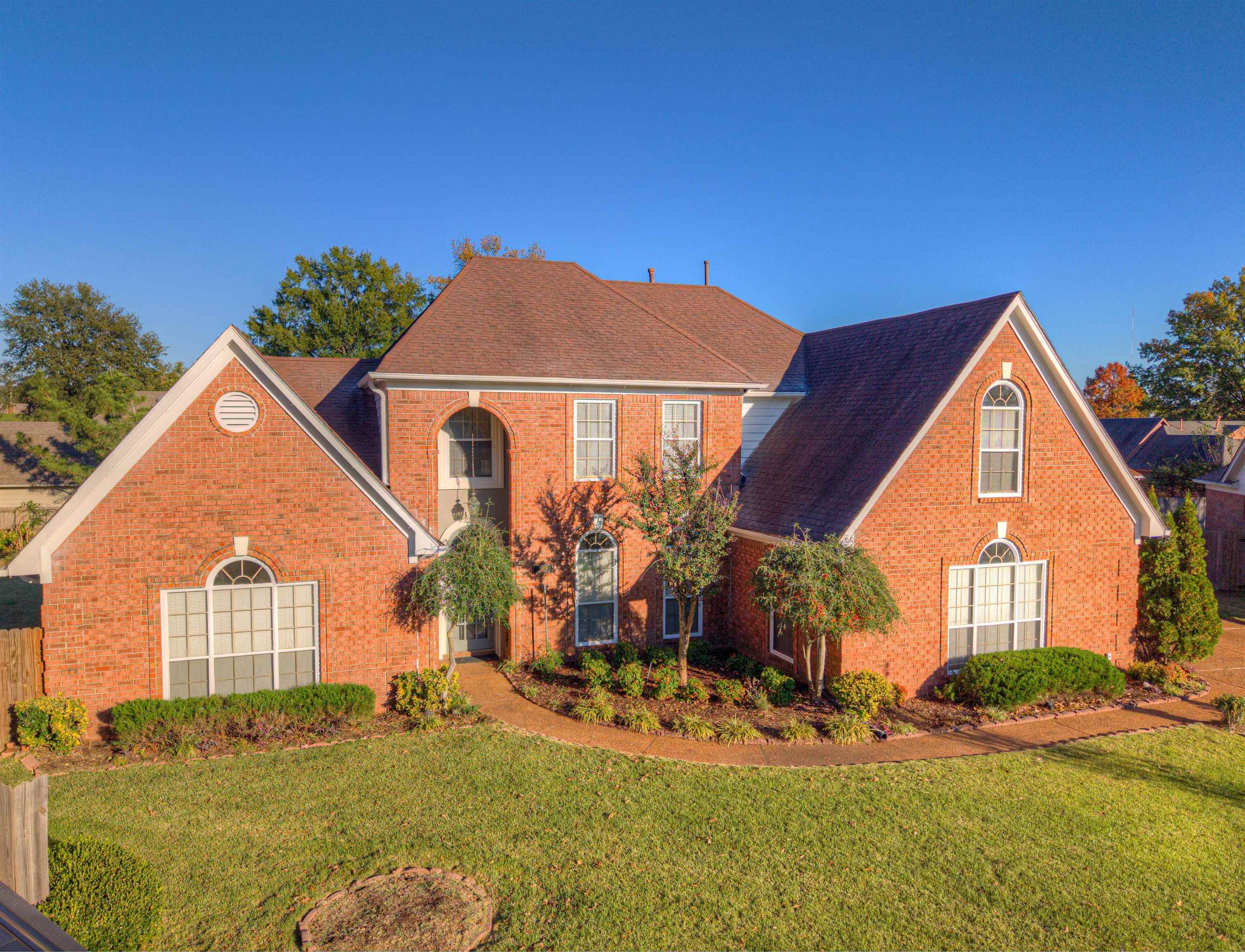 a front view of a house with a yard