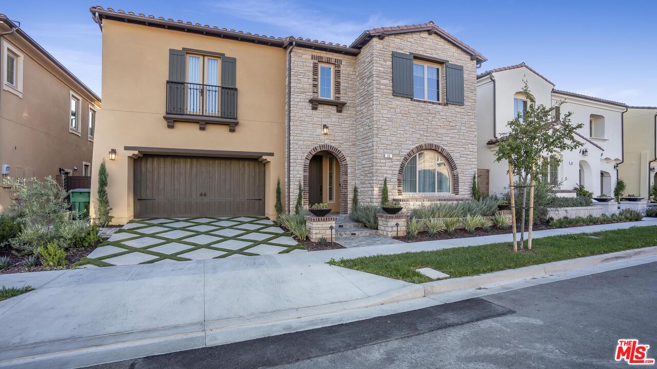 a front view of a house with yard