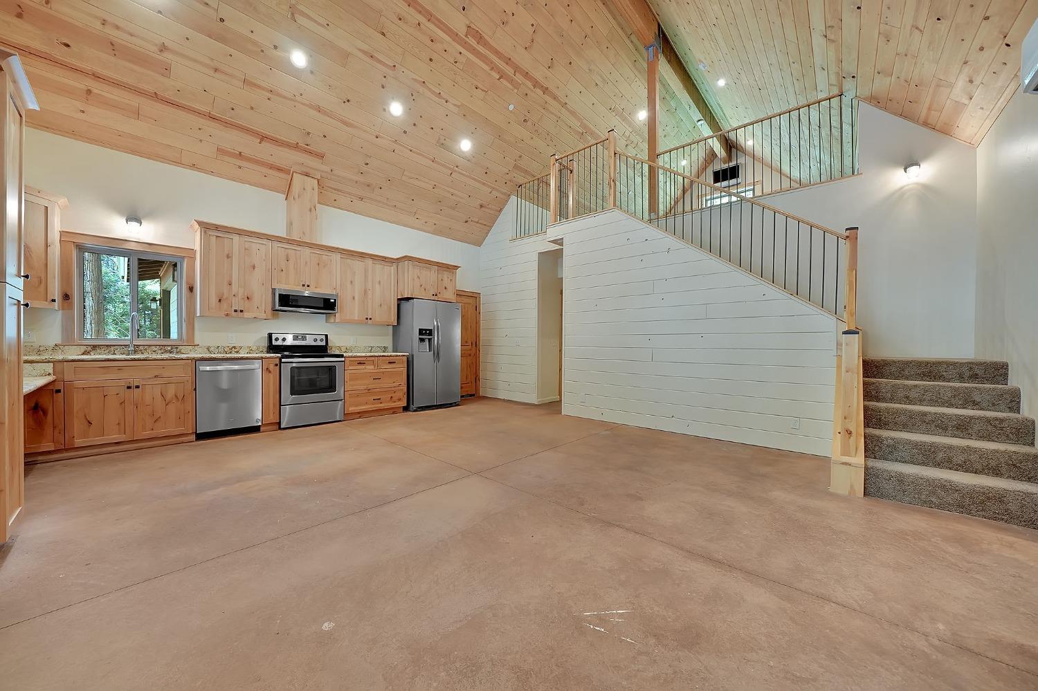 a view of a kitchen with furniture and a kitchen