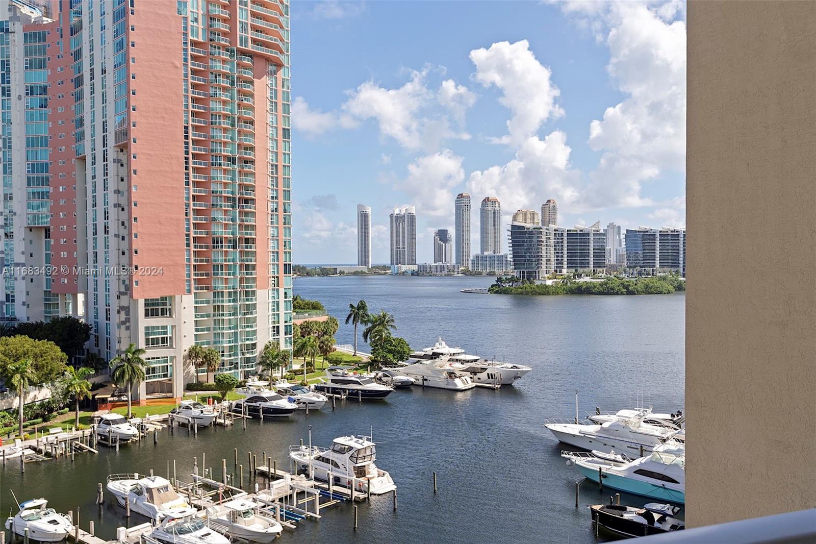 a view of a lake with tall buildings