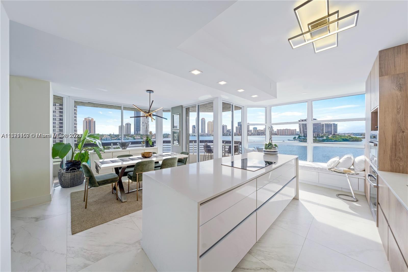 a very nice looking living room with a large window and furniture