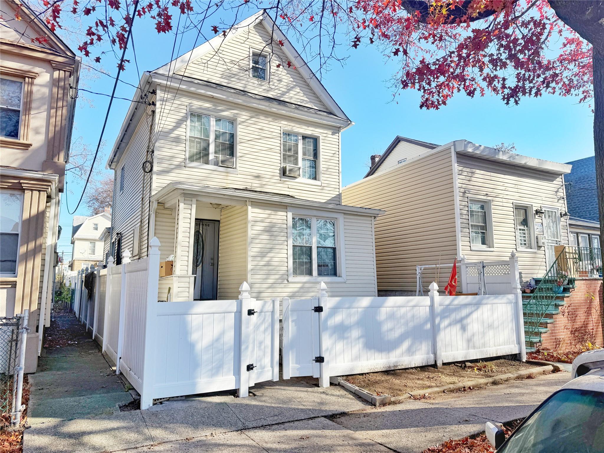 View of front of house with cooling unit