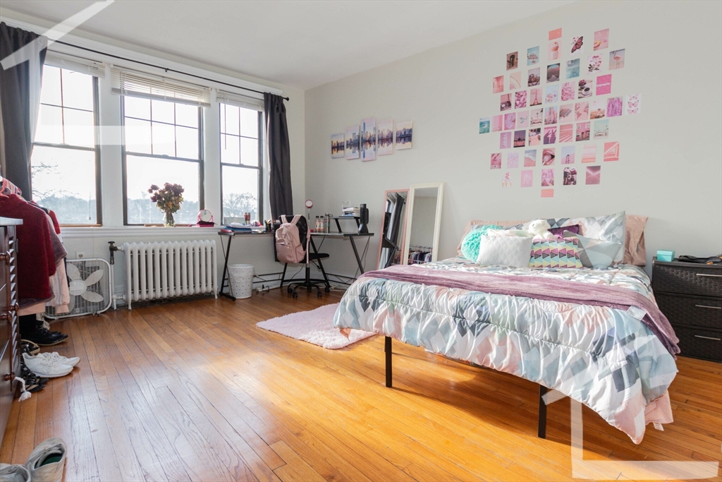 a bed room with a bed and a window