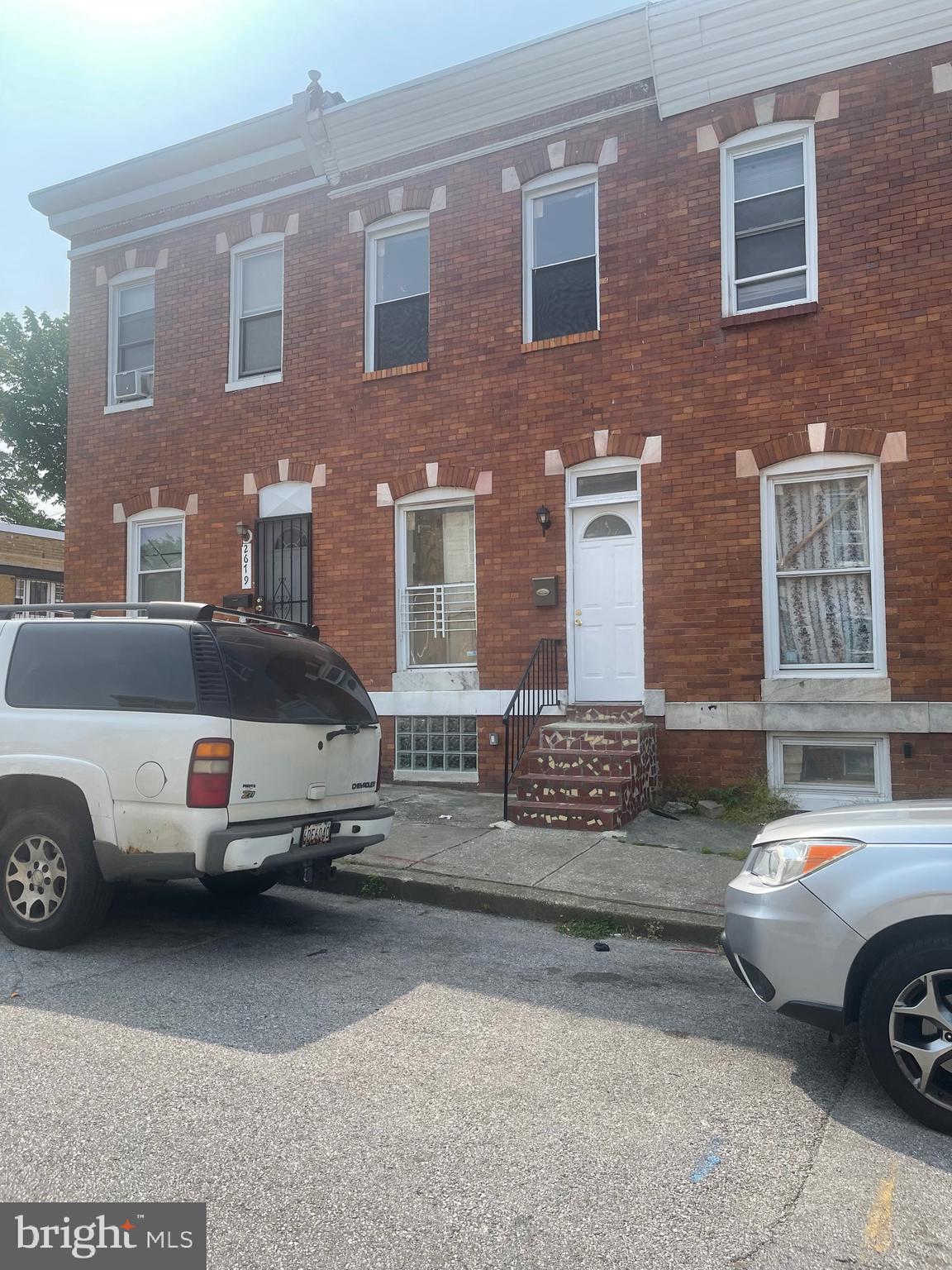 a front view of a house with parking space