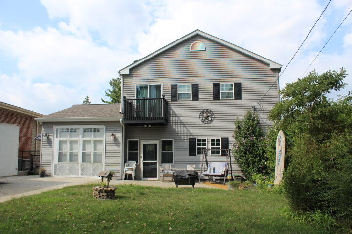 a front view of a house with a yard and porch