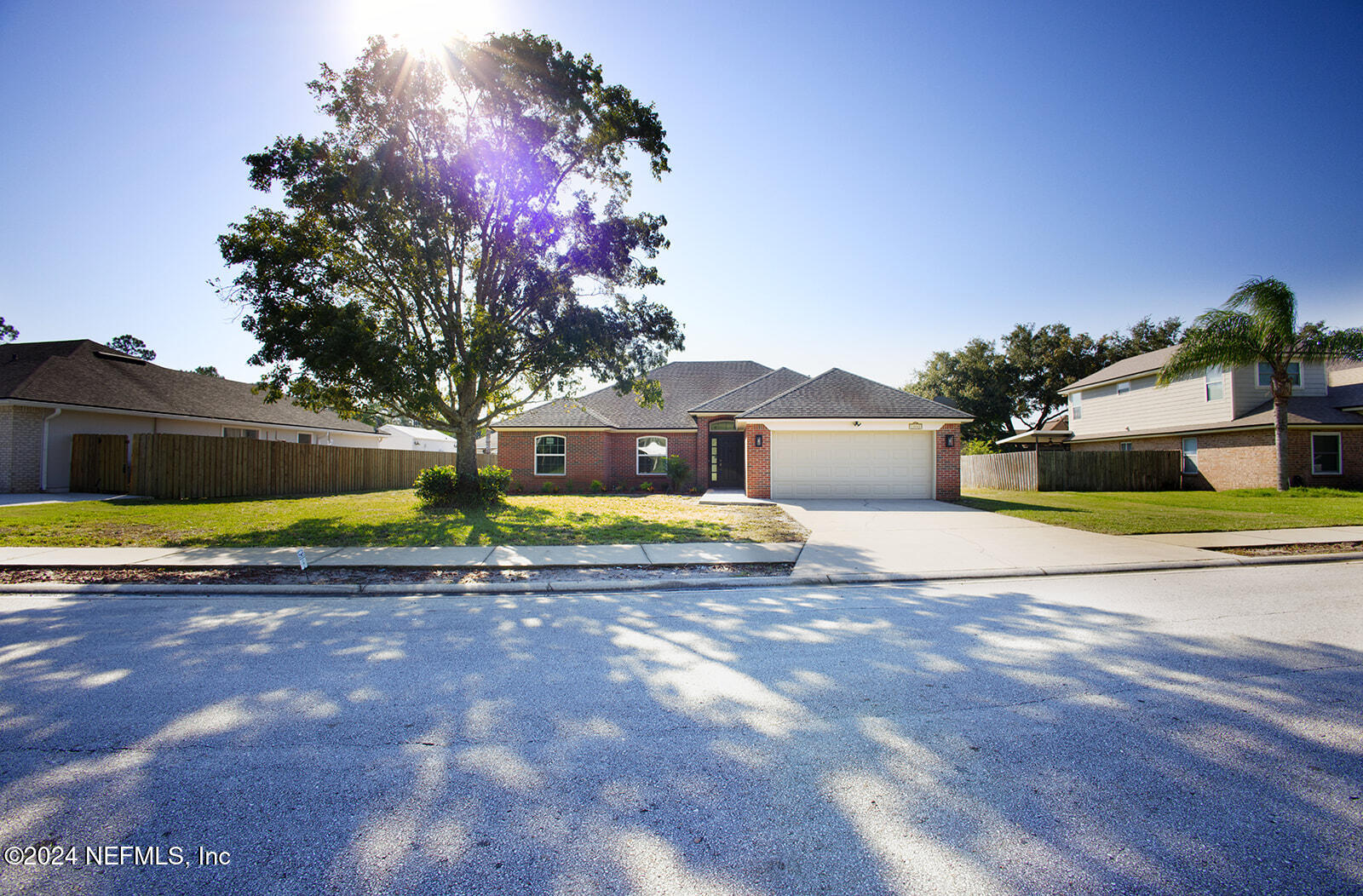 a view of a yard with a house