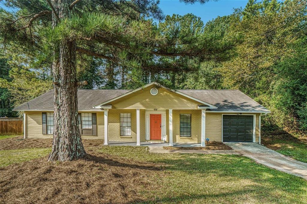 front view of a house with a yard