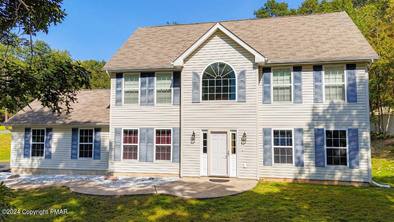 front view of a house with a yard