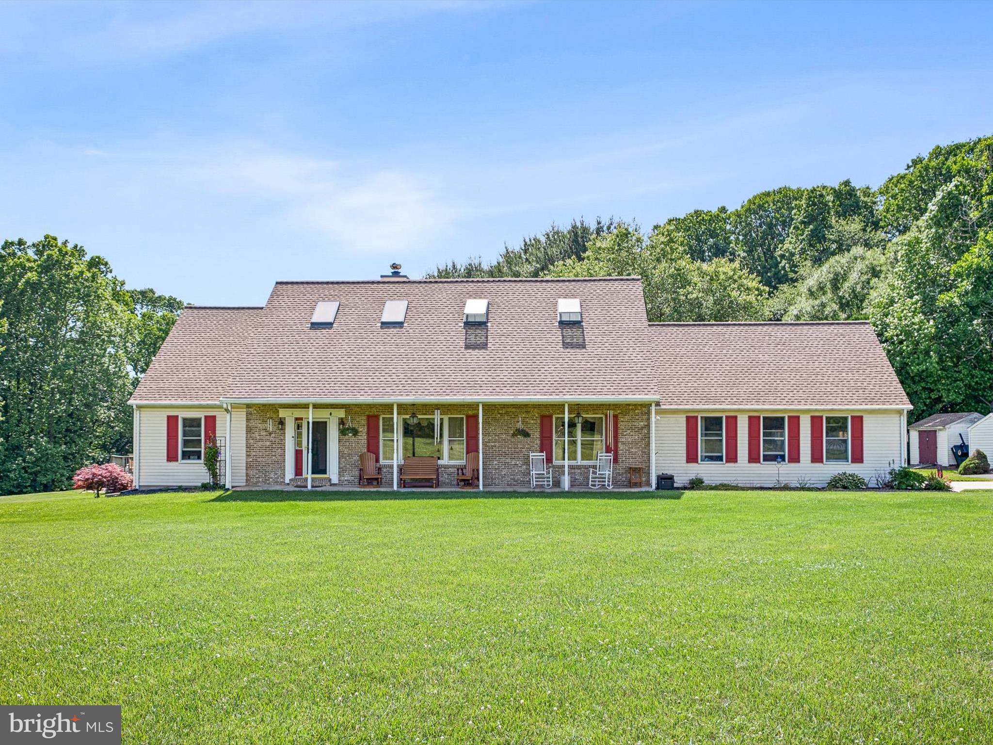 a view of building with yard in front of it