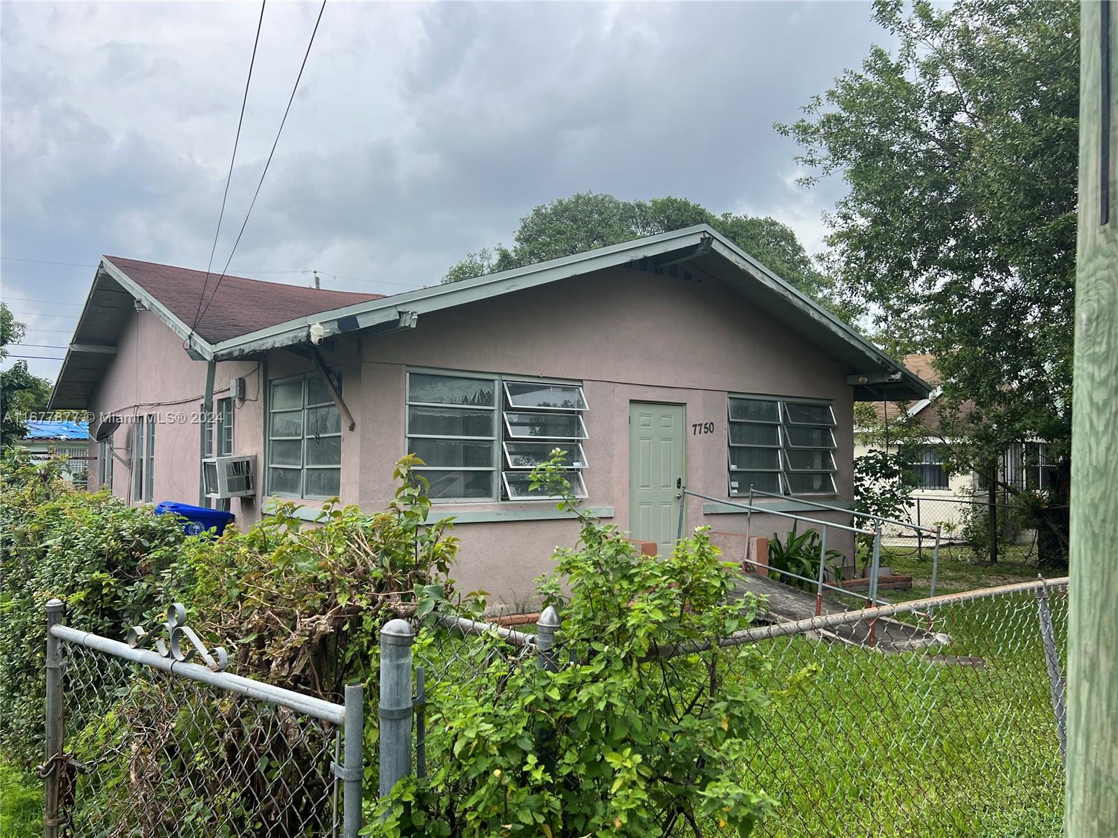 a house with trees in the background