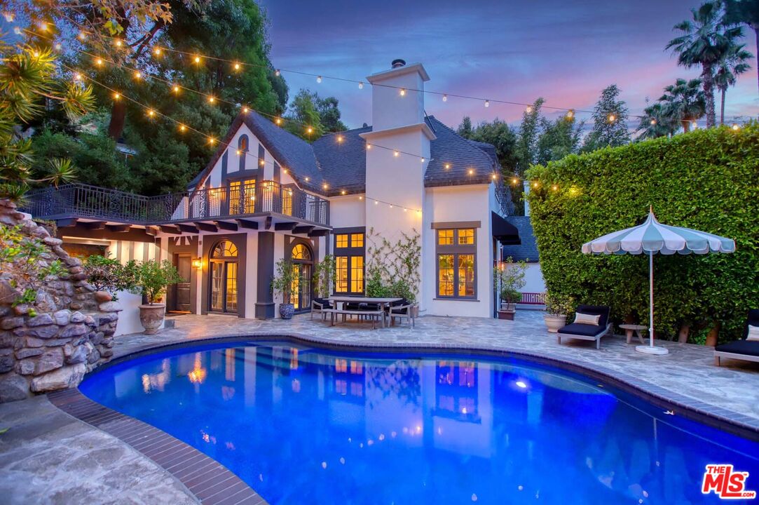 a view of swimming pool with outdoor seating