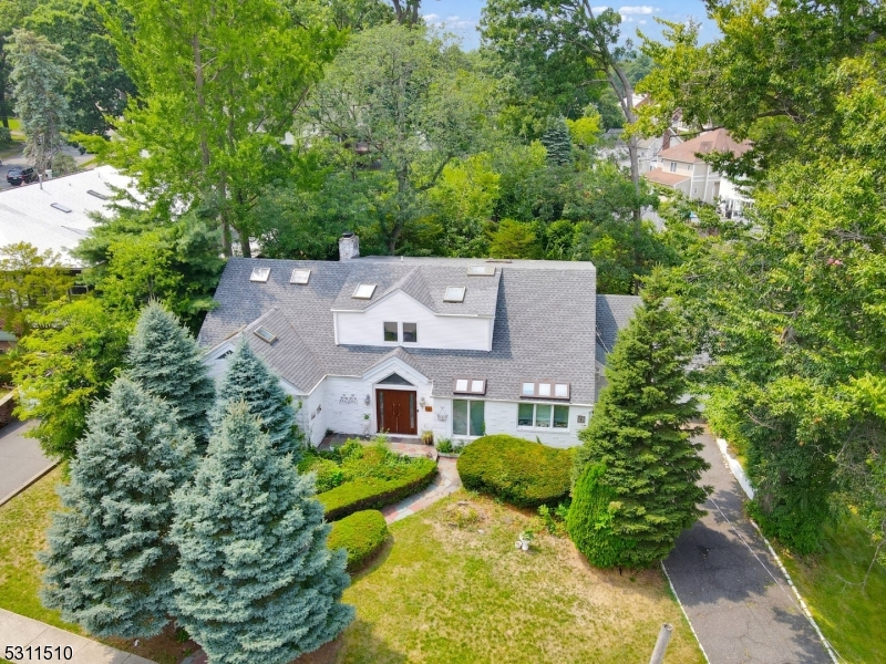 an aerial view of a house with a garden