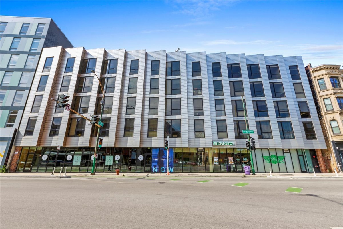 a front view of a building with street view