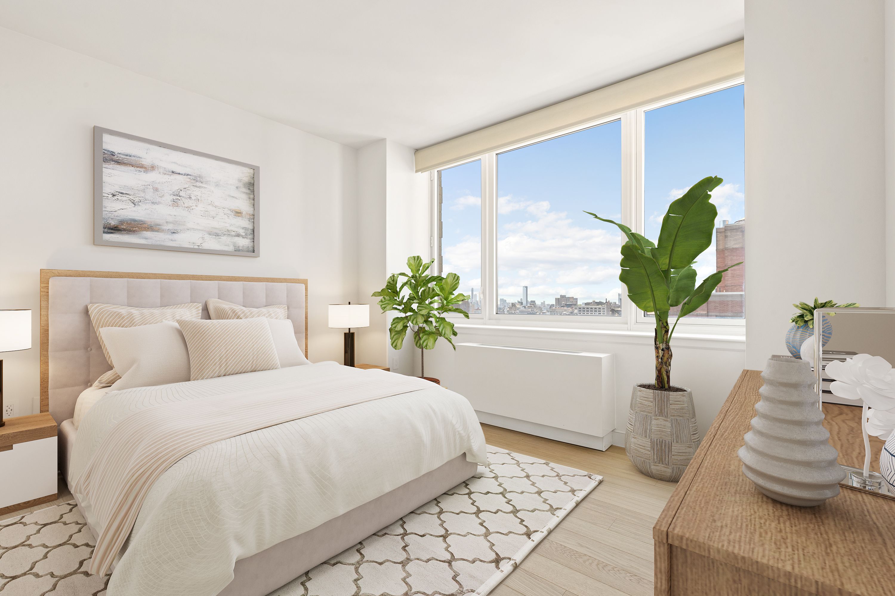 a bedroom with a bed and a potted plant