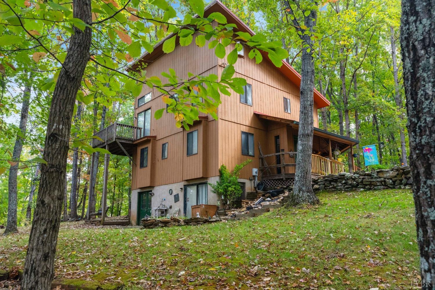 a house that has a tree in front of the house