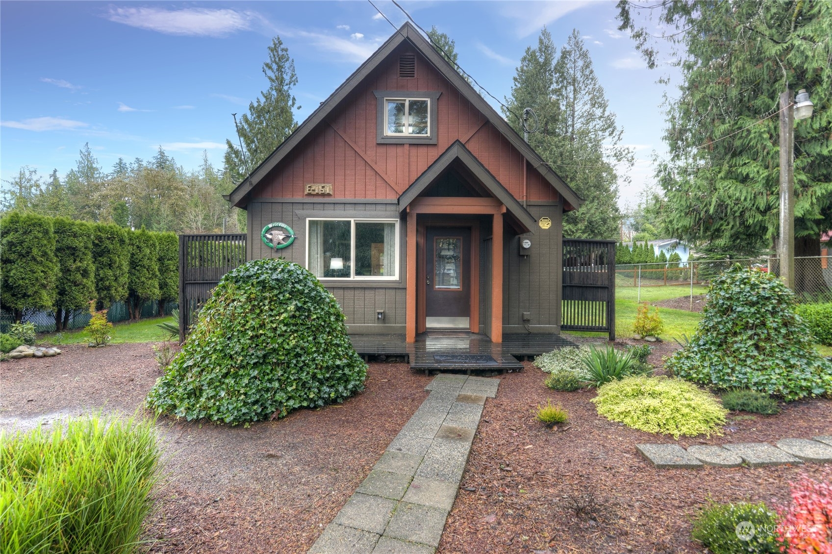 a front view of a house with garden