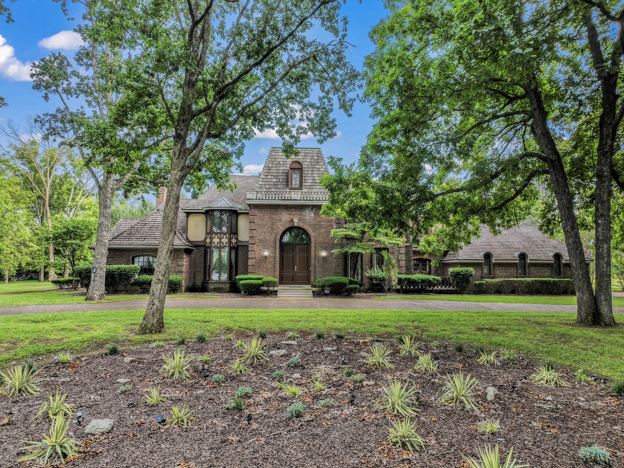 a front view of a house with a yard