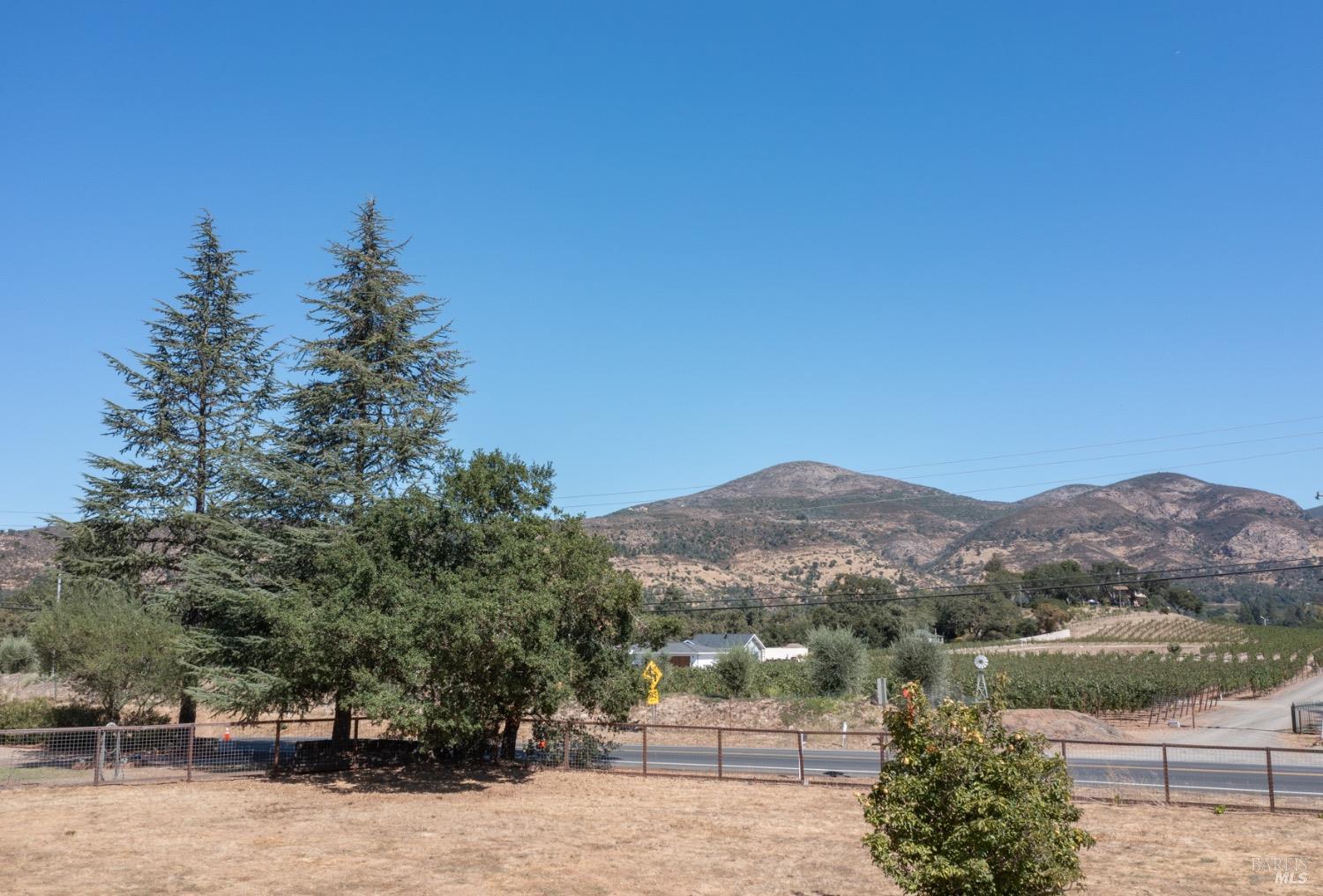 a view of a town with mountains in the background