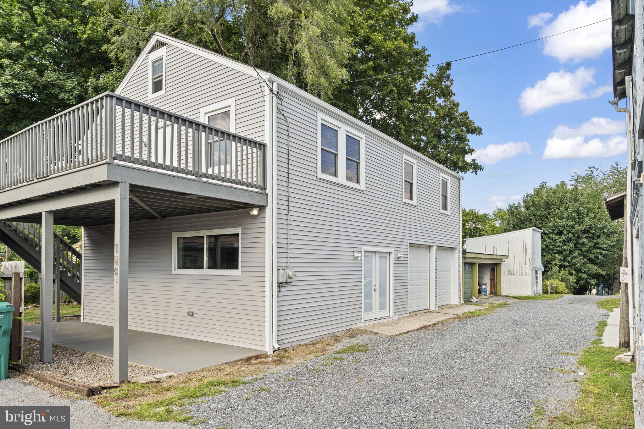 a view of a house with a yard and balcony