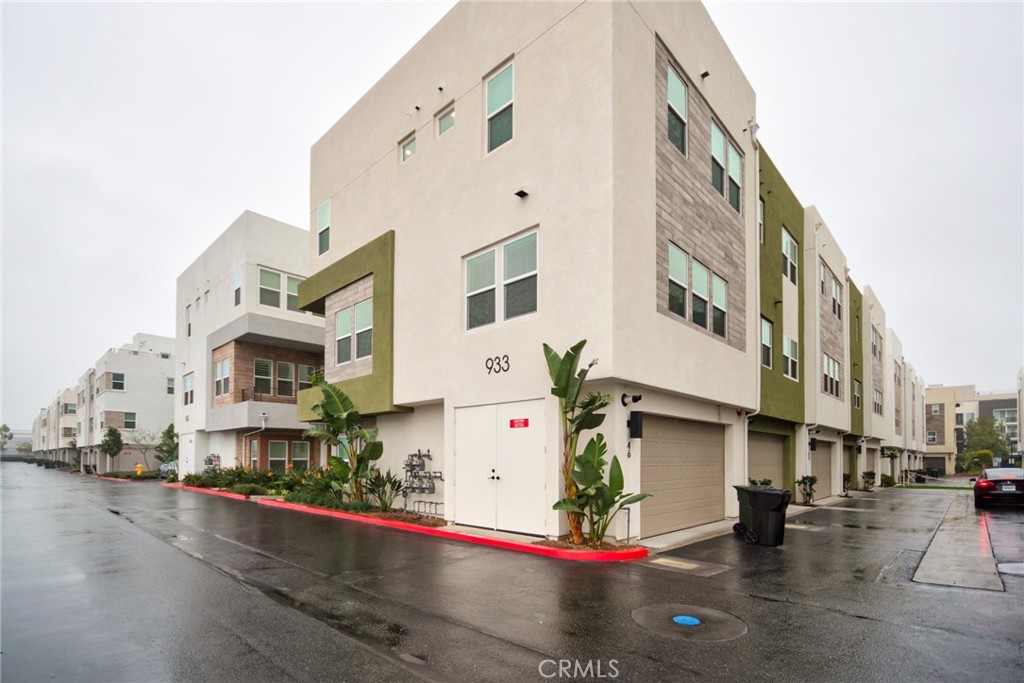 an aerial view of multi story residential apartment building with yard