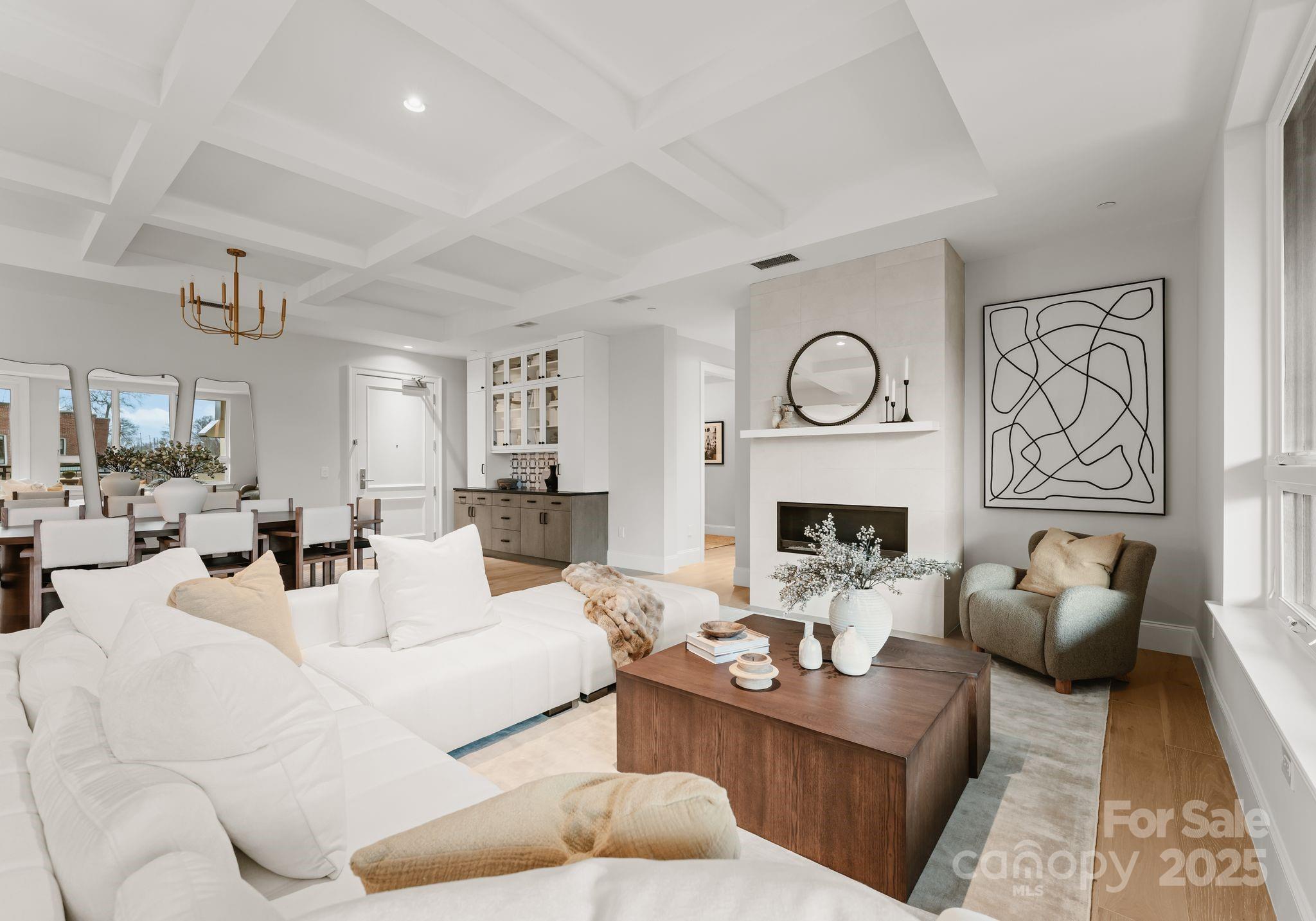 a living room with fireplace furniture and a fireplace