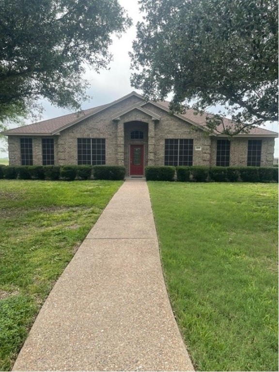 a front view of a house with yard