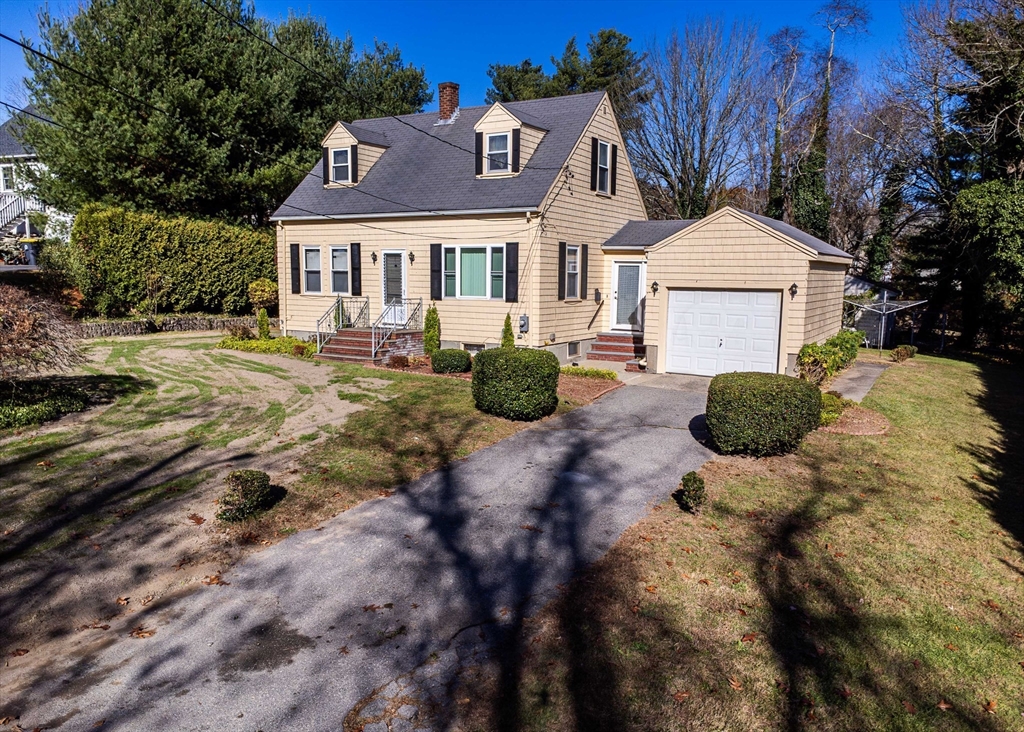 a front view of a house with yard