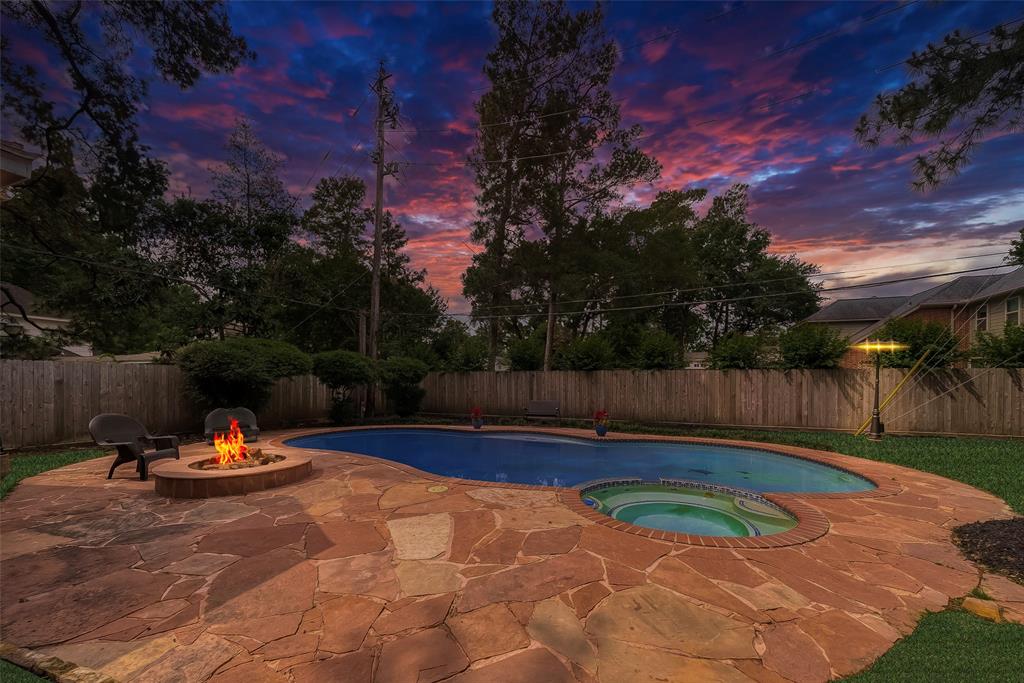 a view of swimming pool with a yard