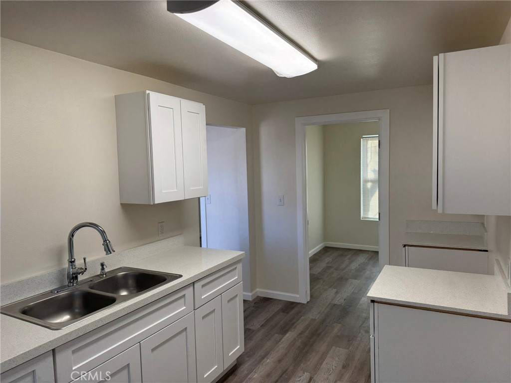 a kitchen that has a sink and a stove