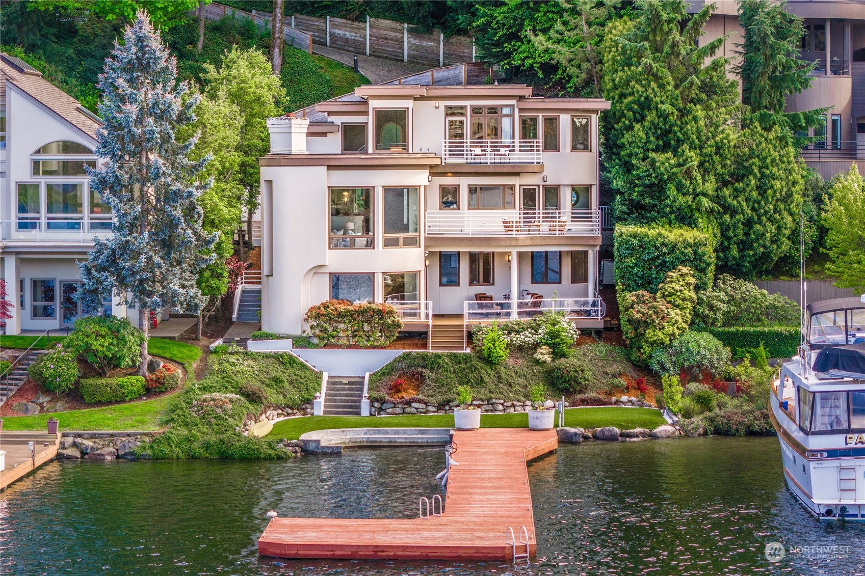 a aerial view of a house with a yard and potted plants