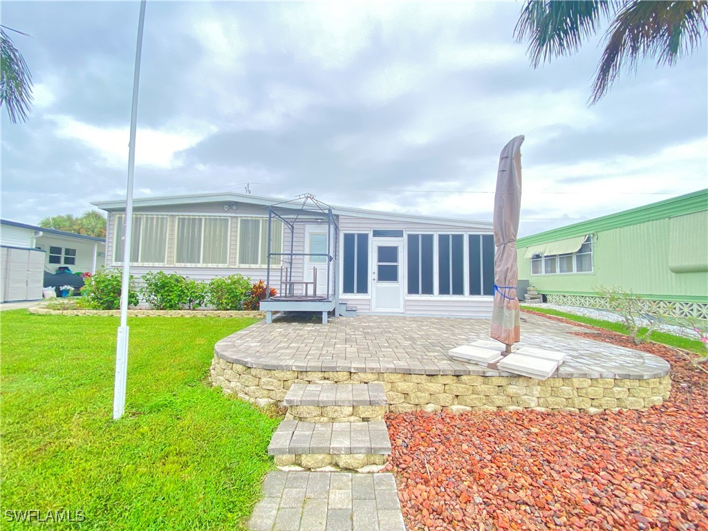 a view of a house with a yard