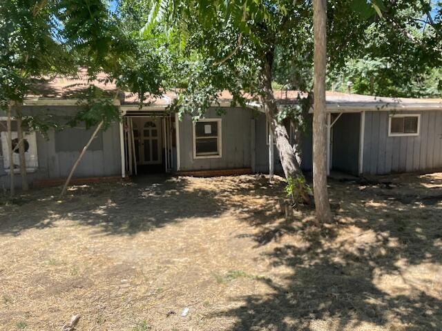 a view of a house with a tree