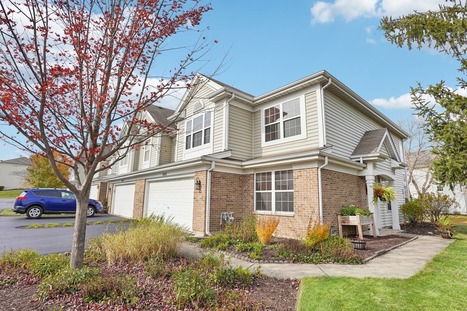 a front view of a house with garden