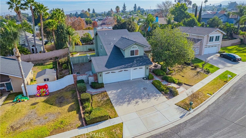 an aerial view of house with yard