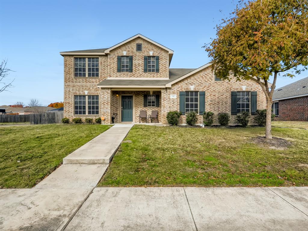 a front view of a house with a yard