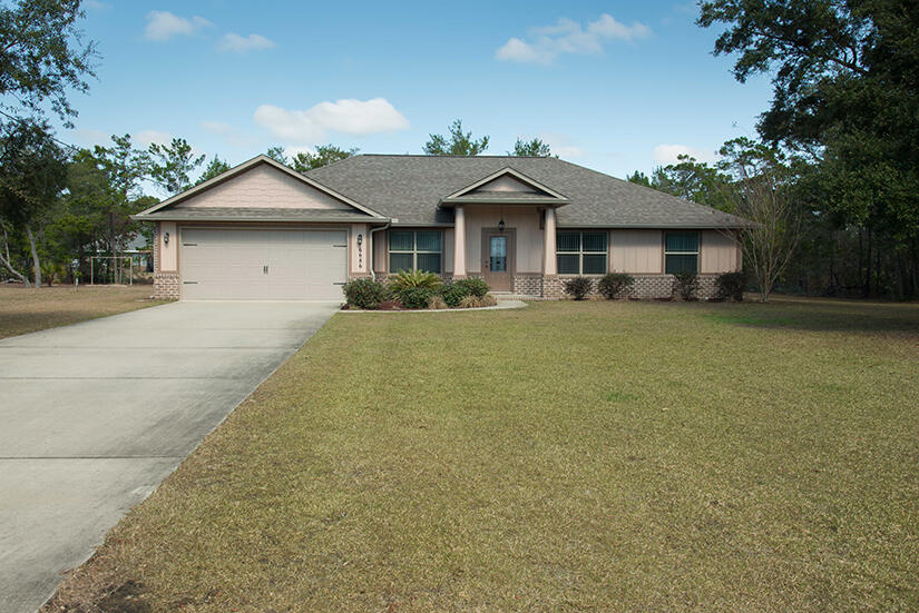 front view of a house with a yard