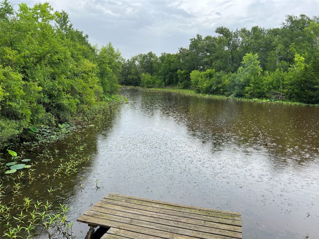 a view of a wooden floor and lake view