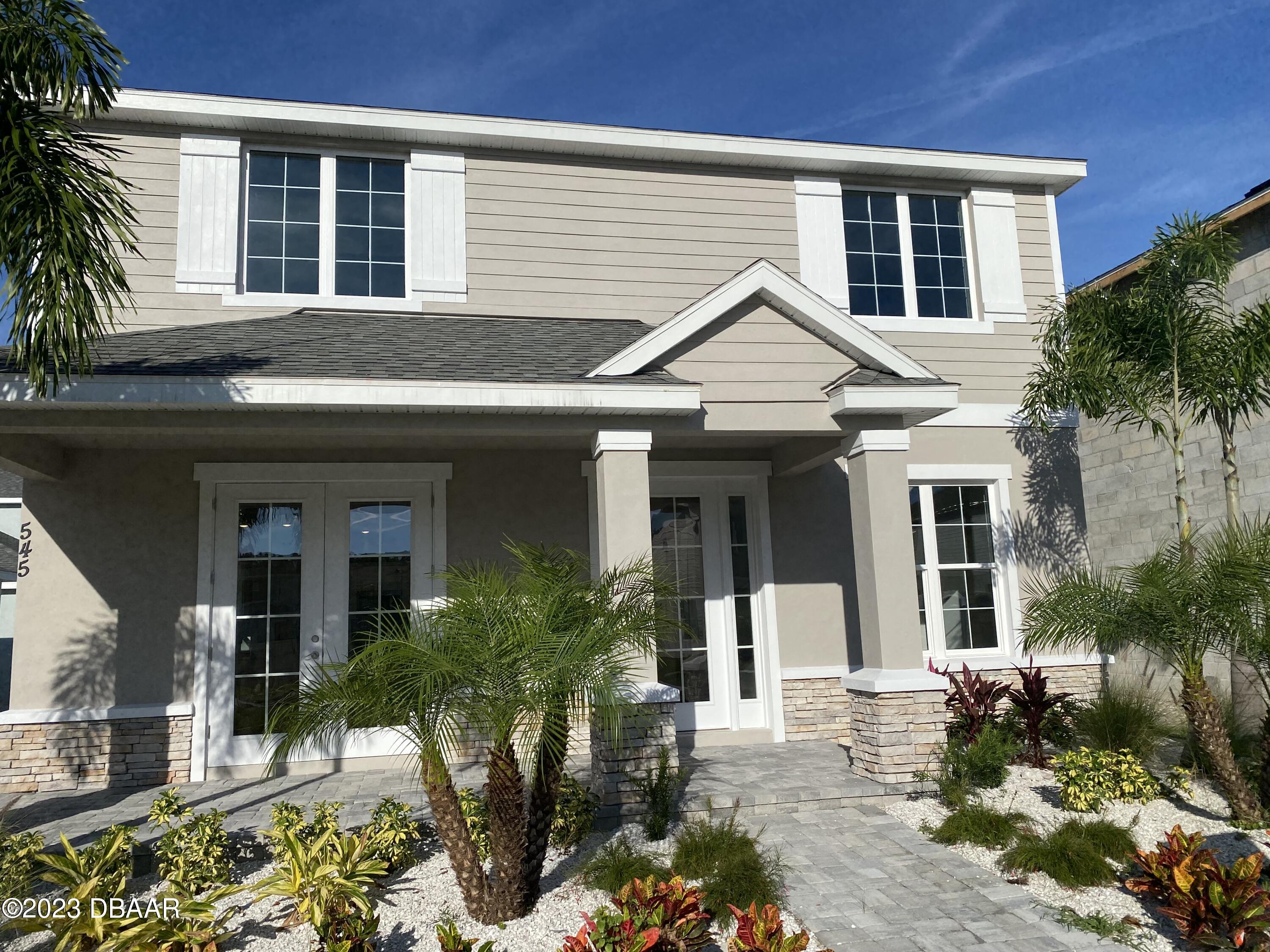 front view of a house with a yard