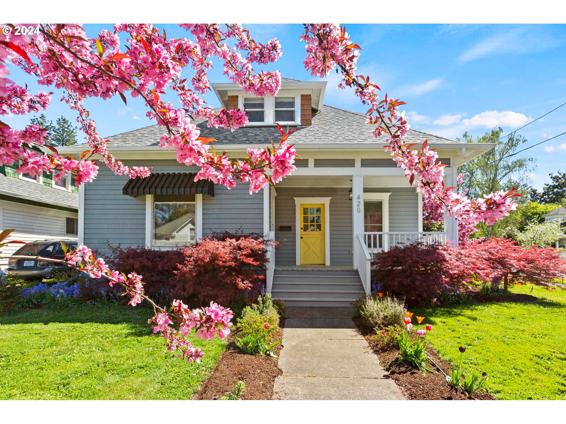 a front view of a house with a yard