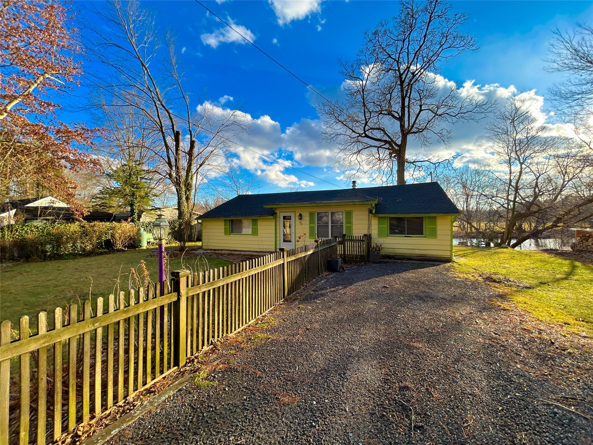 Ranch-style home with a front yard