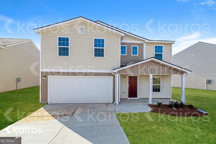 a front view of a house with a yard and porch