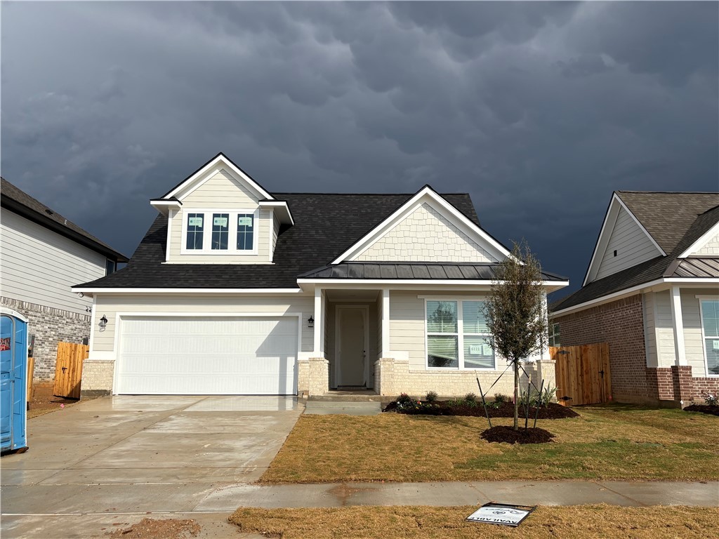 a front view of a house with a garage