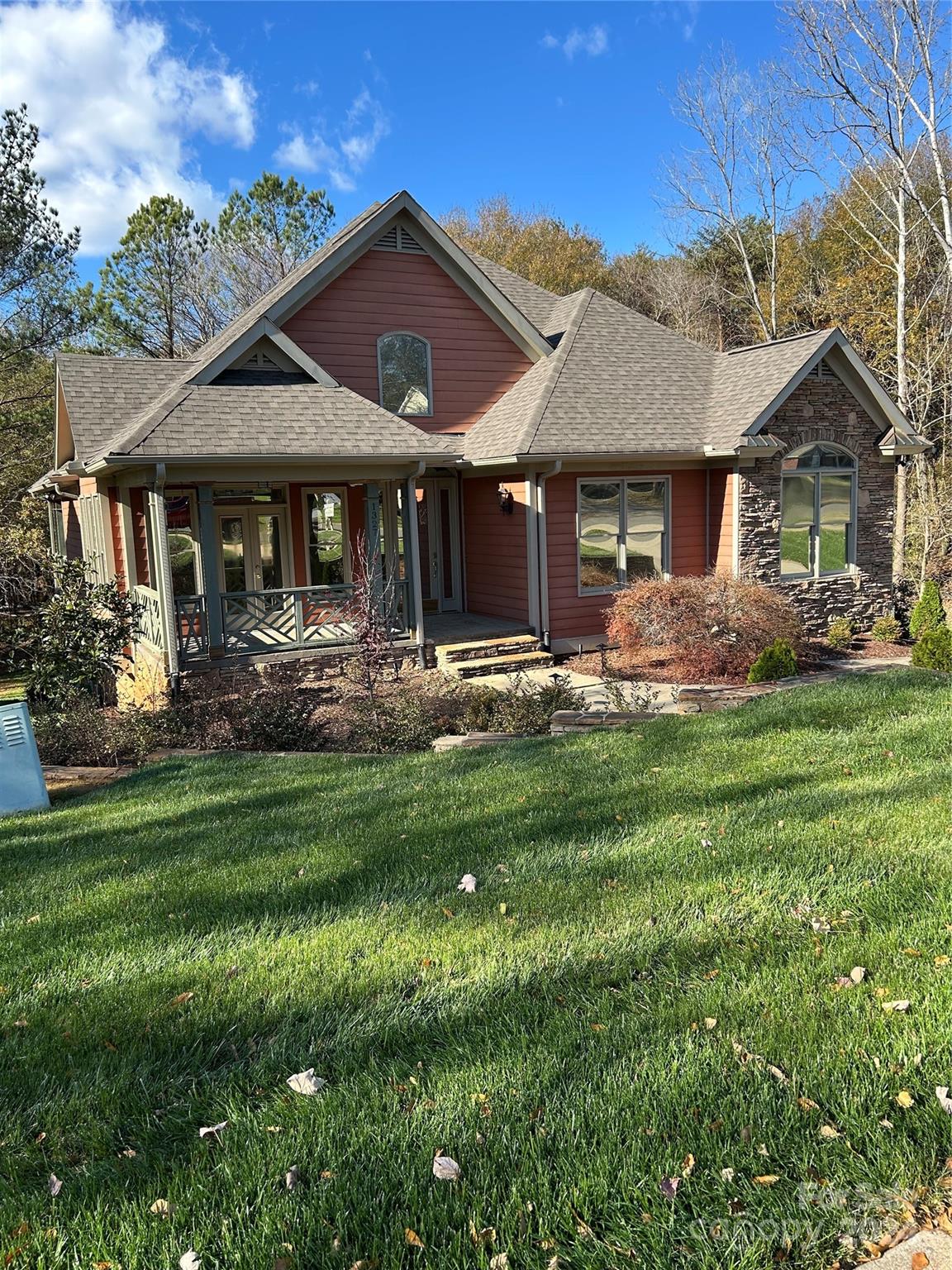 a front view of a house with garden