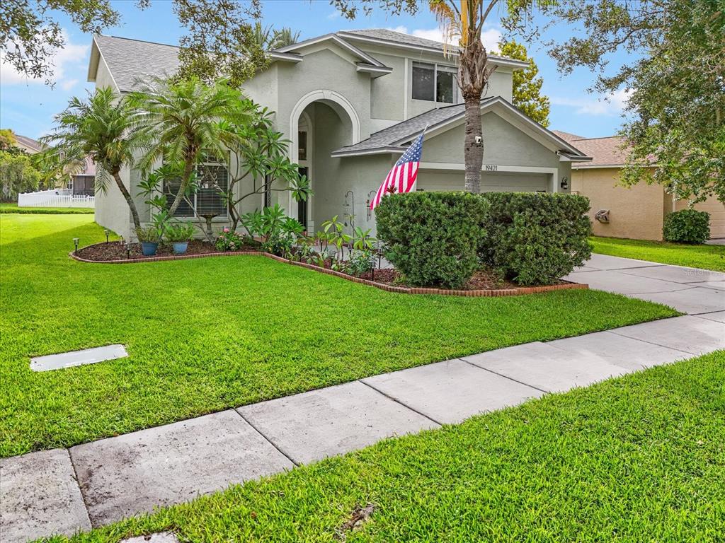 a front view of a house with a yard