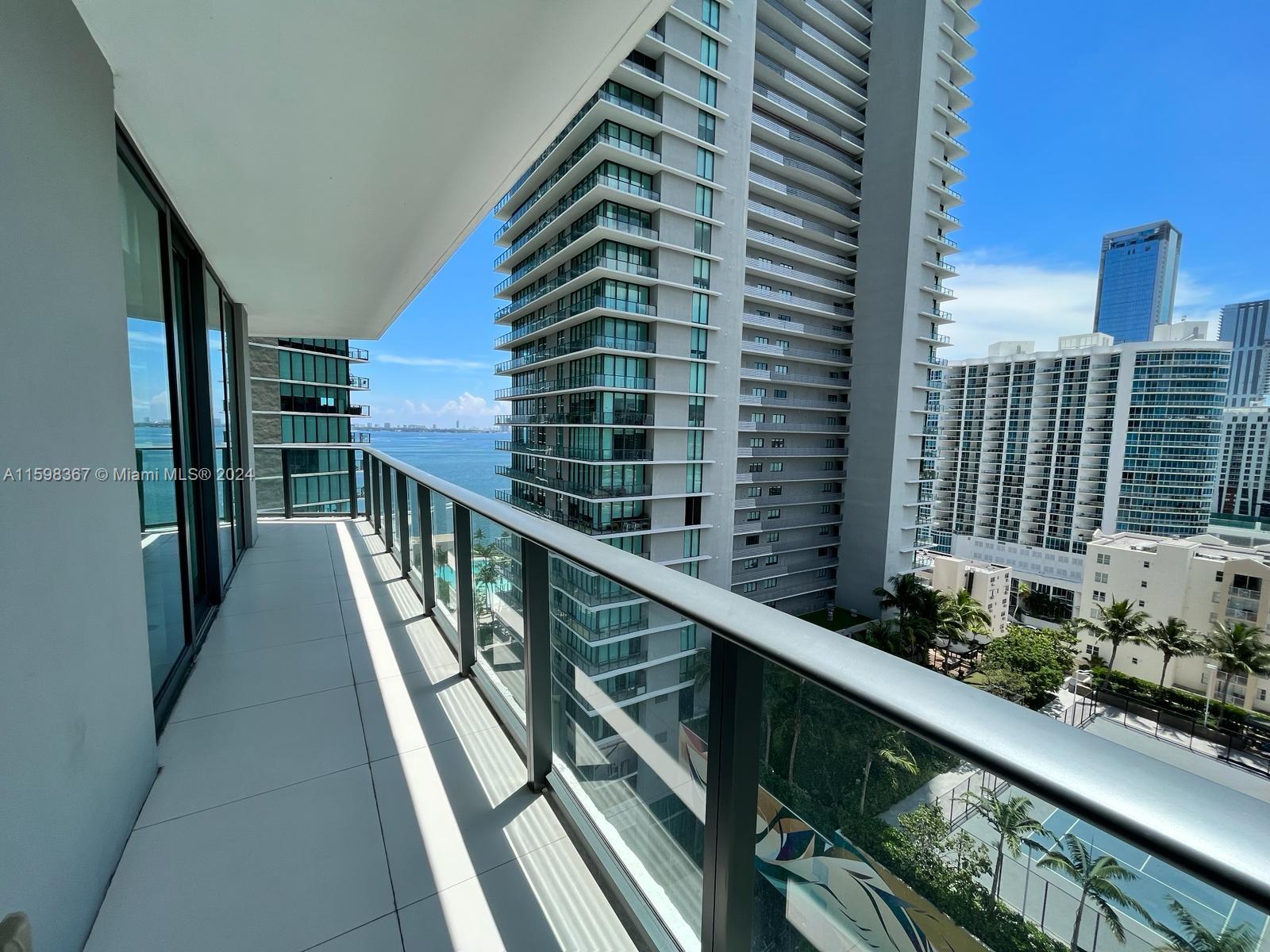 a view of balcony with wooden floor and fence